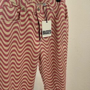 Pink and white ragged jeans